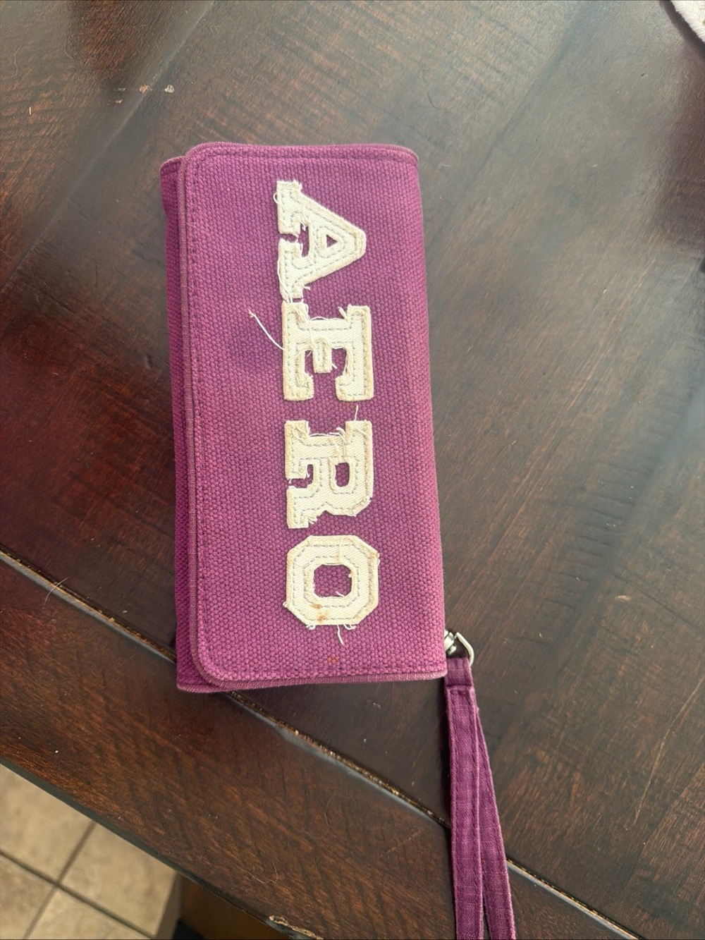 aerie Plum Canvas Wristlet with Cream Logo